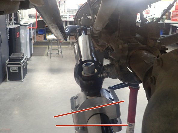 - With the wheels turned completely to the left and the stabilizer in fully extended position: