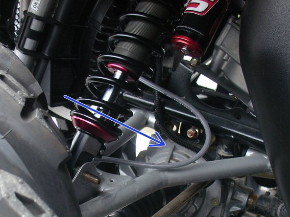 On Stage 2, Stage 4 and Stage 5 models, the lower shock eyelets should be installed with the rebound adjuster oriented towards the rear of the vehicle as shown by the blue Arrow on the photo ( left side shown ). If needed, you can turn the lower eyelet to orient properly.