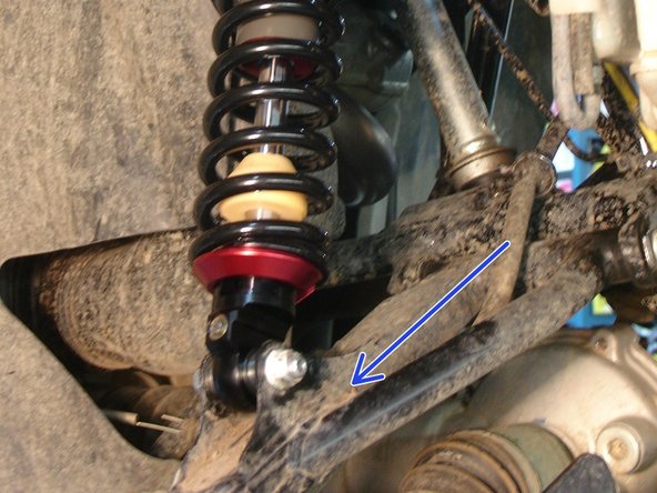 On Stage 2, Stage 4 and Stage 5 models, the lower shock eyelets should be installed with the rebound adjuster oriented towards the outside of the vehicle as shown by the blue Arrow on the photo ( right side shown ). If needed, you can turn the lower eyelet to orient properly.