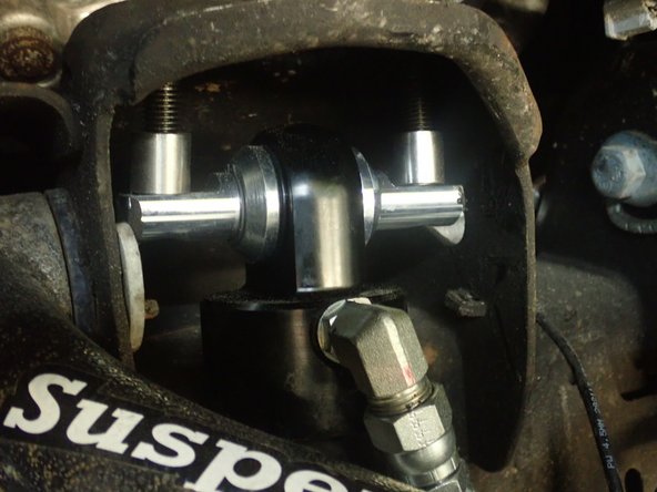 Install provided washers on provided bolts, then pass bolts thru bracket and frame's holes.