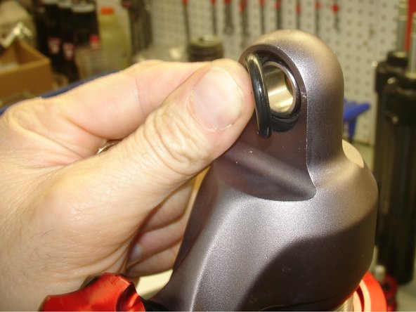 Rear upper and lower bushings are not pressfit. First install o-rings on both sides of upper and lower bearings.