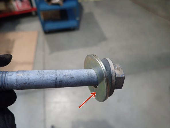 Then install supplied washer on UPPER BOLT as shown by red arrow.