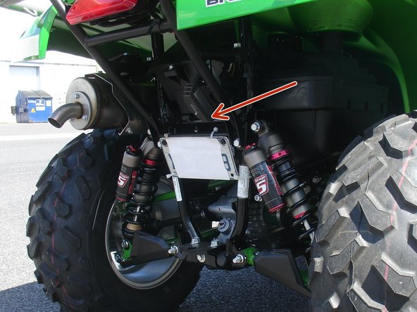 Install both new Elka rear shock with the piggyback reservoir at the top and oriented towards the rear of the vehicle as indicated by the red Arrow on the photo.