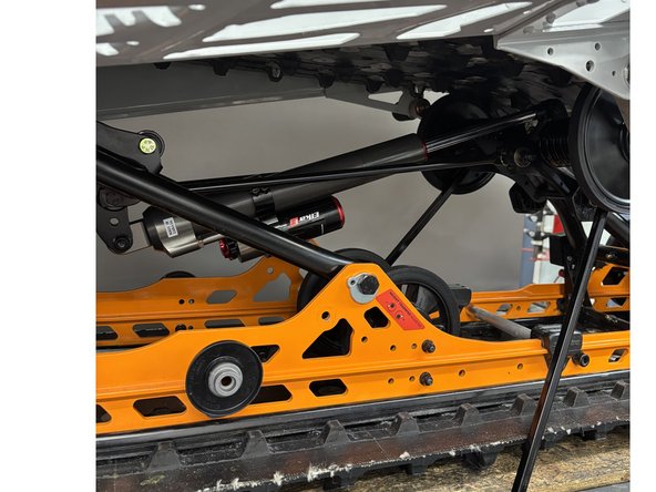 Remove the rear shock according to the procedures recommended by the manufacturer.