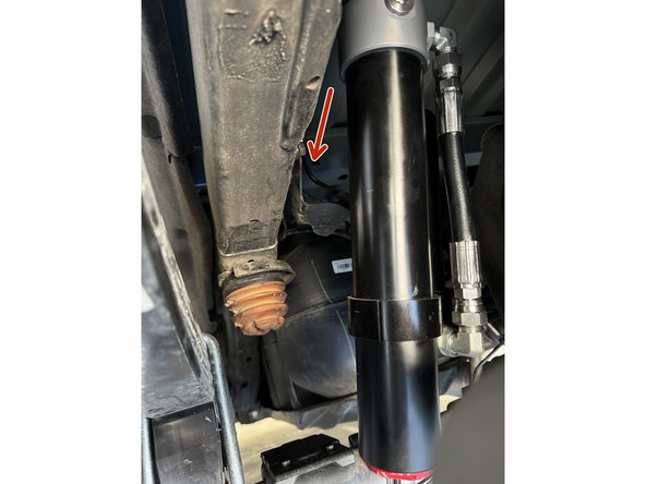 Remove upper and lower bolts from OEM shocks. Keep OEM bolts to install Elka shocks.