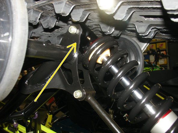 The rebound adjuster screw must be oriented toward the floor to have access with a long screwdriver across the rear suspension arm as shown by the yellow Arrow. You can turn the eyelet to orient properly before installing the shock.