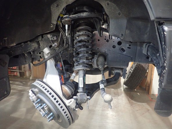 Remove the stock shocks.