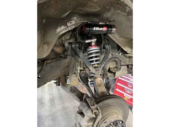 Reinstall the lower pin bolts and torque to 50 Ft-Lb.