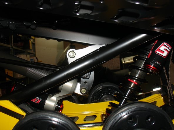 Install the Elka center shock with piggyback reservoir at the top and pointing towards the right side of the snowmobile as show on the photo.