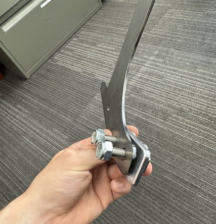 Use the supplied hardware to hold the reservoir bracket in the hole in the  frame reveal by removing the plastic cap.