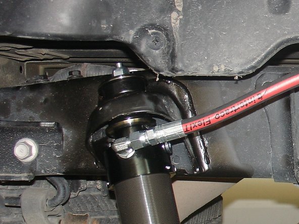 Apply some supplied grease on the 2 rubber isolators.