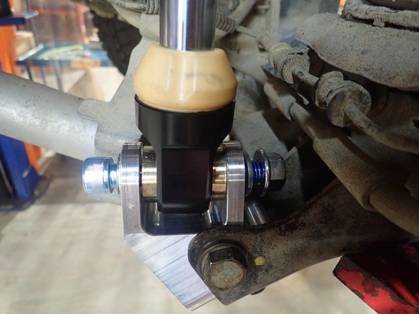 First, enlarge existing lower hole in the lower oem bracket as shown in picture. Use a 10mm or 7/16&quot; drill.