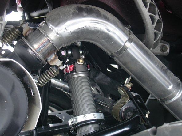 On Stage 1 and Stage 2, the left and the right shock are the same. Just install them with the shraeder nitrogen valve at the top of vehicle. (Right side shown).