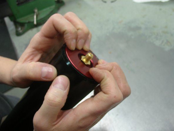 Re-install the retaining ring , and make sure it is sit in is groove