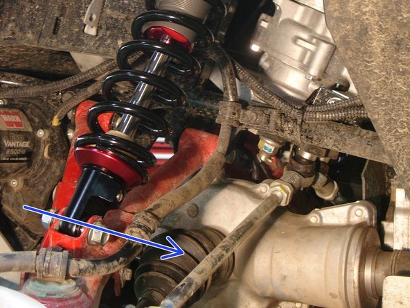 On Stage 2, Stage 4 and Stage 5 models, the lower shock eyelets should be installed with the rebound adjuster oriented towards the rear of the vehicle as shown by the blue Arrow on the photo ( left side shown ). If needed, you can turn the lower eyelet to orient properly.