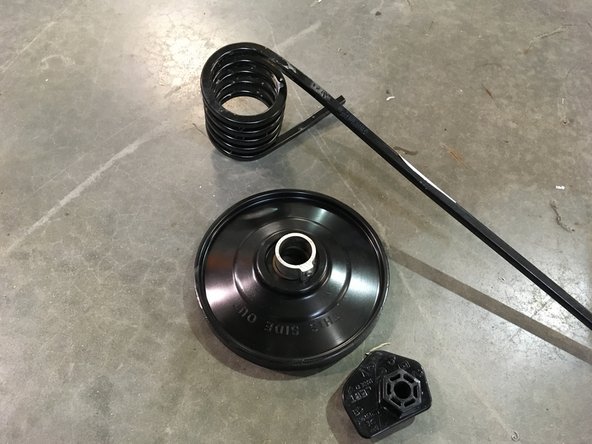 Remove the Idler wheel, the torsion spring and the spring adjsuter on both side.