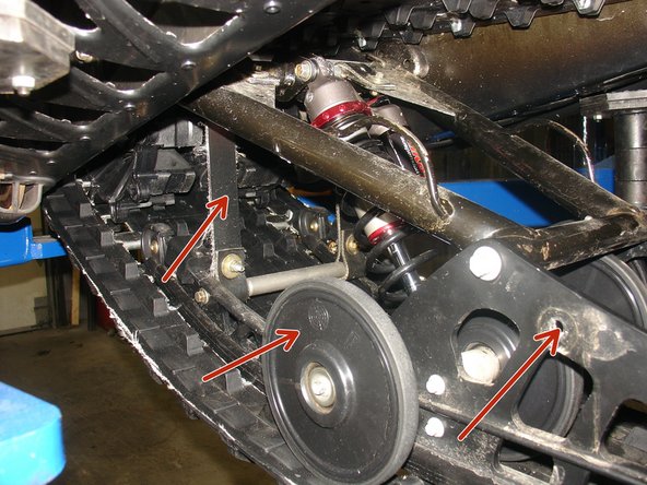 Remove the limiter strap and idler wheels.