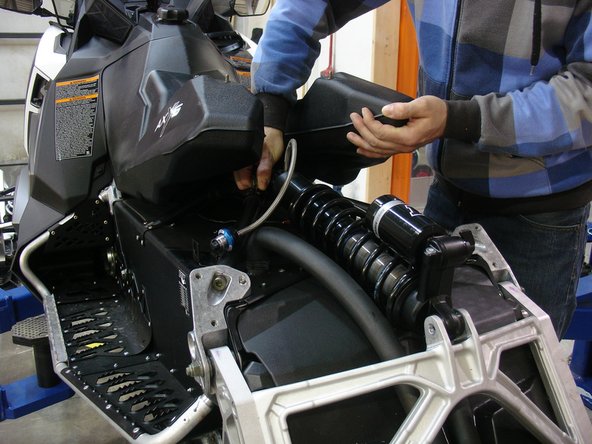 Remove the stock rear shock bolt by lifting the gaz tank upward until the bolt can be remove