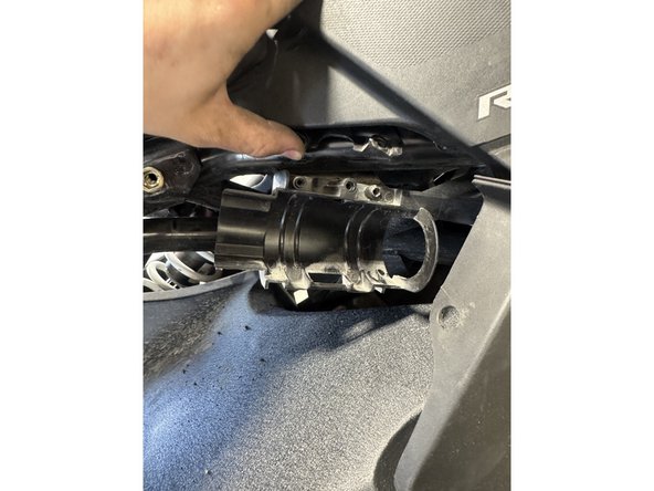 Move the reservoir out of the bracket as shown.