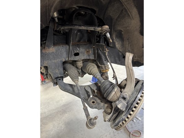 Remove the shock from the vehicle.