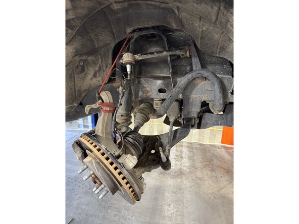 Remove the shock from the vehicle.