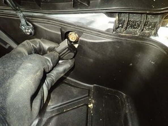 Remove the front plastic caps located in the front trunk to have access to the upper shock bolt. (Does not inclue the XMR trim.)