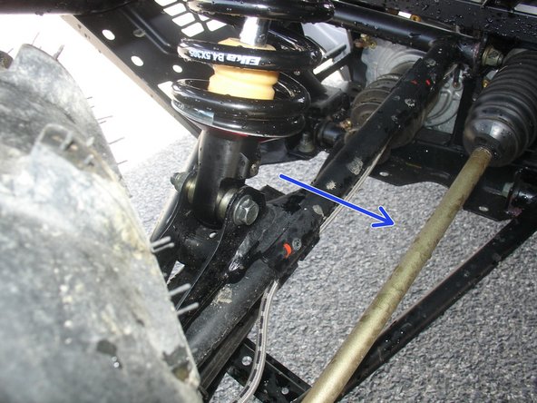On Stage 2, Stage 4 and Stage 5 models, the lower shock eyelets should be installed with the rebound adjuster oriented towards the rear of the vehicle as shown by the blue Arrow on the photo ( left side shown ). If needed, you can turn the lower eyelet to orient properly.