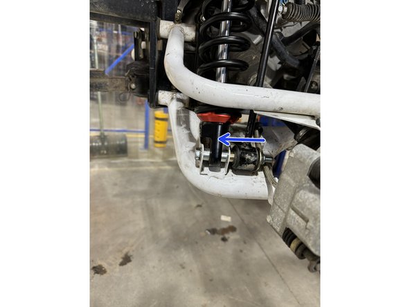 On Stage 2, Stage 4 and Stage 5 models, the lower shock eyelets should be installed with the rebound adjuster oriented towards the rear of the vehicle as shown by the blue Arrow on the photo ( right side shown ). If needed, you can turn the lower eyelet to orient properly.