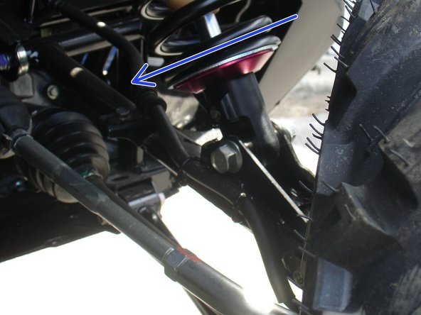 On Stage 2, Stage 4 and Stage 5 models, the lower shock eyelets should be installed with the rebound adjuster oriented towards the rear of the vehicle as shown by the blue Arrow on the photo ( Right side shown ). If needed, you can turn the lower eyelet to orient properly.