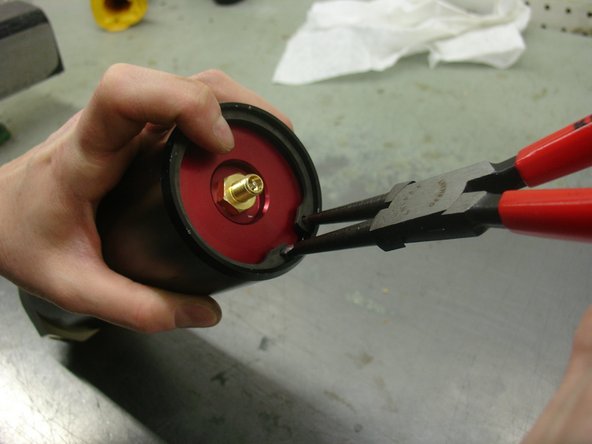 Re-install the retaining ring , and make sure it is sit in is groove