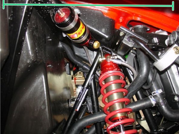 Install the reservoir with the banjo bolt (connected to the reservoir) facing towards the inside of the vehicule. The reservoir must be attached to the frame using the provided rubber mounts and metal collars. Do not over tighten the metal collars on the reservoir (torque to 6 lbs-in). Make sure to route the hose according to the pictures.