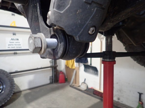 Remove upper and lower shock bolts, then remove OEM shocks.