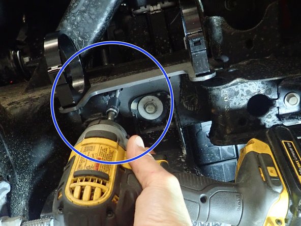 Secure the bracket with provided metal screw in one of the two smaller bracket's holes as shown by blue circle. Bracket must be parallel to frame. (optionnal)