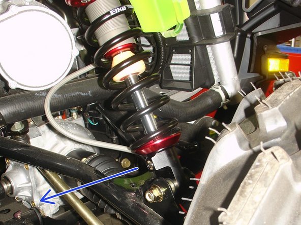 On Stage 2, Stage 4 and Stage 5 models, the lower shock eyelets should be installed with the rebound adjuster oriented towards the rear of the vehicle as shown by the blue Arrow on the photo ( right side shown ). If needed, you can turn the lower eyelet to orient properly.