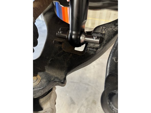 Reinstall the lower pin bolt and torque to 50 Ft-Lb.