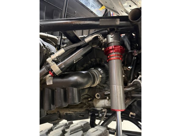 On models with rebound, the lower shock eyelets must be installed with the rebound adjuster oriented toward the rear of the vehicle. If needed, rotate the lower eyelet to ensure proper orientation.