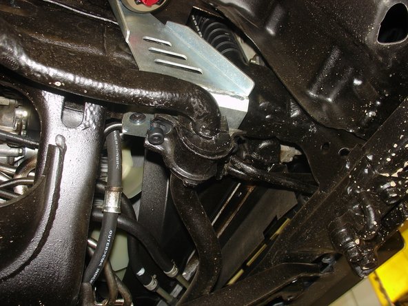 Install the sway bar supports with the short supplied bolts into the new Elka reservoir bracket.