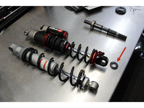 Liberally greasing the bushing area and including the two washers supplied with the Elka shock absorber.