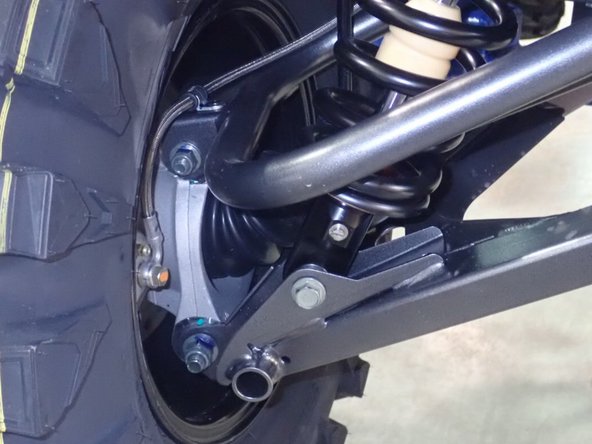 On Stage 2, Stage 4, and Stage 5 models the rebound adjuster located on lower eyelet of the shocks should be oriented towards the rear of the vehicle, as shown. (Leftt side shown ). If needed, you can turn the lower eyelet to orient properly.