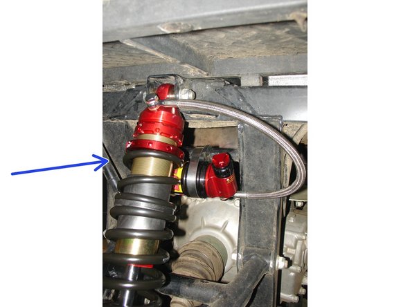 Install the reservoir with the banjo bolt (connected to the reservoir) facing towards the bottom of the vehicule.  The reservoir must be attached to the frame using the provided rubber mounts and metal collars.  Do not over tighten the metal collars on the reservoir (torque to 6 lbs-in).  Make sure to route the hose according to the pictures.