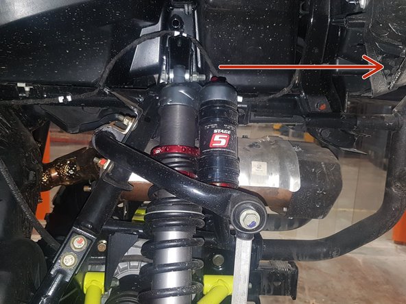 Install both new Elka rear shocks with the piggyback reservoir at the top and oriented towards the rear and away of the vehicle as indicated by the red Arrow on the photo. ( Left side shown ).