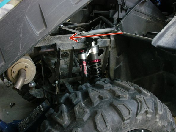 Install both new Elka rear shock with the piggyback reservoir at the top and oriented towards the rear of the vehicle as indicated by the red Arrow on the photo. (Right side shown)