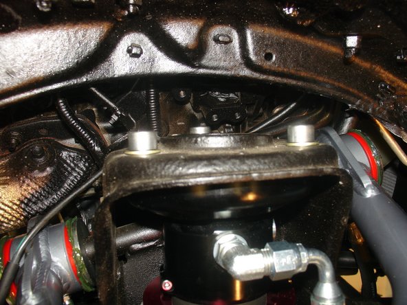 Install supplied upper bolts but don't fully tighten them.