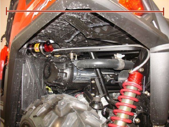 Install the reservoir with the banjo bolt (connected to the reservoir) facing towards the inside of the vehicule. The reservoir must be attached to the frame using the provided rubber mounts and metal collars. Do not over tighten the metal collars on the reservoir (torque to 6 lbs-in). Make sure to route the hose according to the pictures.