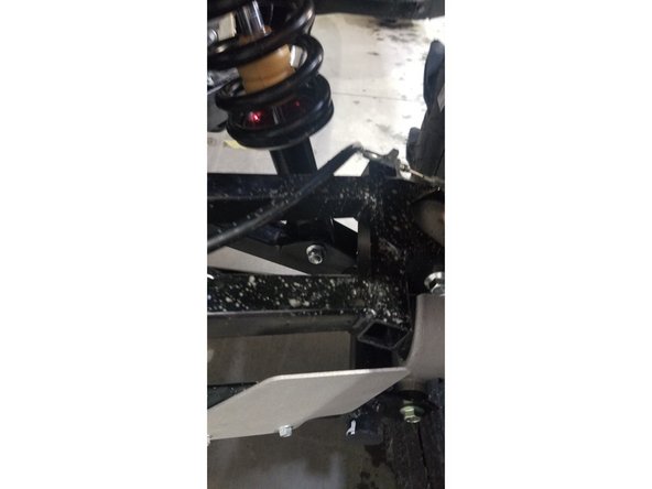 Install the left and right new Elka rear shock with the piggyback reservoir at the top. On Stage 1 and Stage 2, the left and the right shock are the same. Just install them with the shraeder nitrogen valve at the top of vehicle.