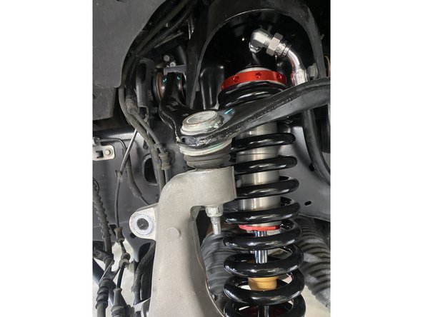 Install the Elka shocks using provided lower bolts and the provided upper bolts. Hoses must face the front of vehicle as shown (right side shown).