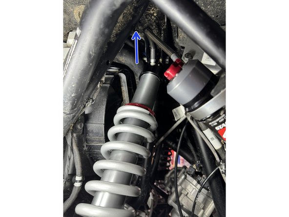 ON THE LEFT SIDE: When installed on vehicle with the shock head up: the hose is facing the left side of vehicle as indicated by the blue arrow.