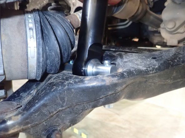 IMPORTANT NOTE: The lower mounting pin should be oriented with flats on the lower arm as shown. You can rotate the pin to have the good alignmnent with the holes.