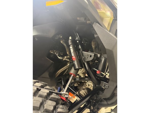 On models with rebound, the lower shock eyelets must be installed with the rebound adjuster oriented toward the rear of the vehicle. If needed, rotate the lower eyelet to ensure proper orientation.