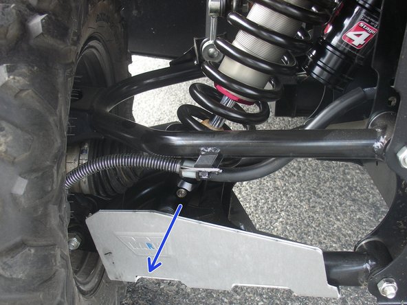 On Stage 2, Stage 4, and Stage 5 models the rebound adjuster located on lower eyelet of the shocks should be oriented towards the rear of the vehicle, as shown. (Left side shown ). If needed, you can turn the lower eyelet to orient properly.